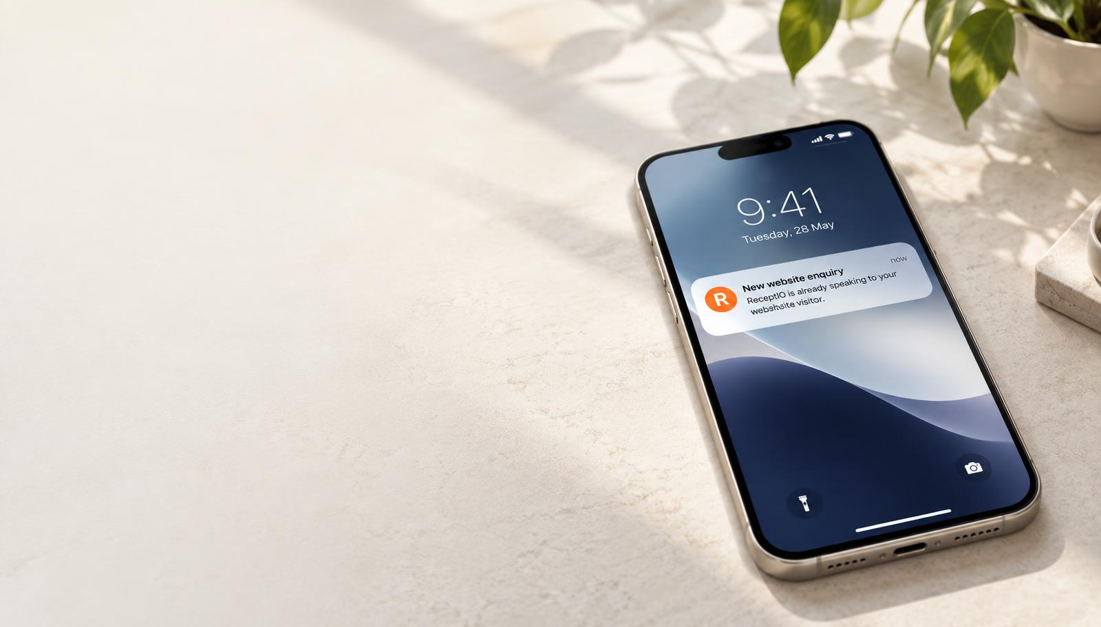A phone receiving a new website enquiry notification from ReceptIO
